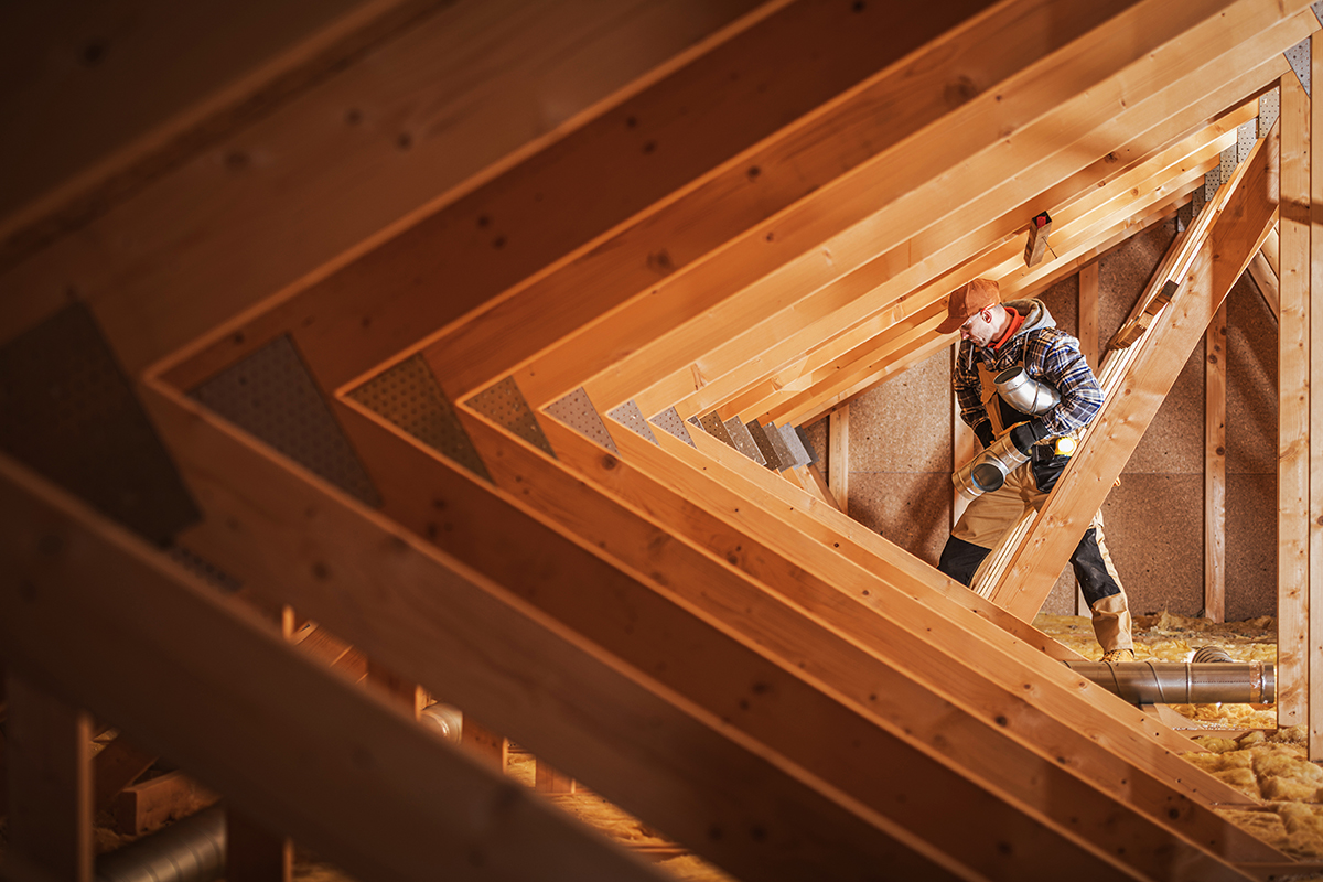 Construction Worker Performing Ventilation Ducts Installation